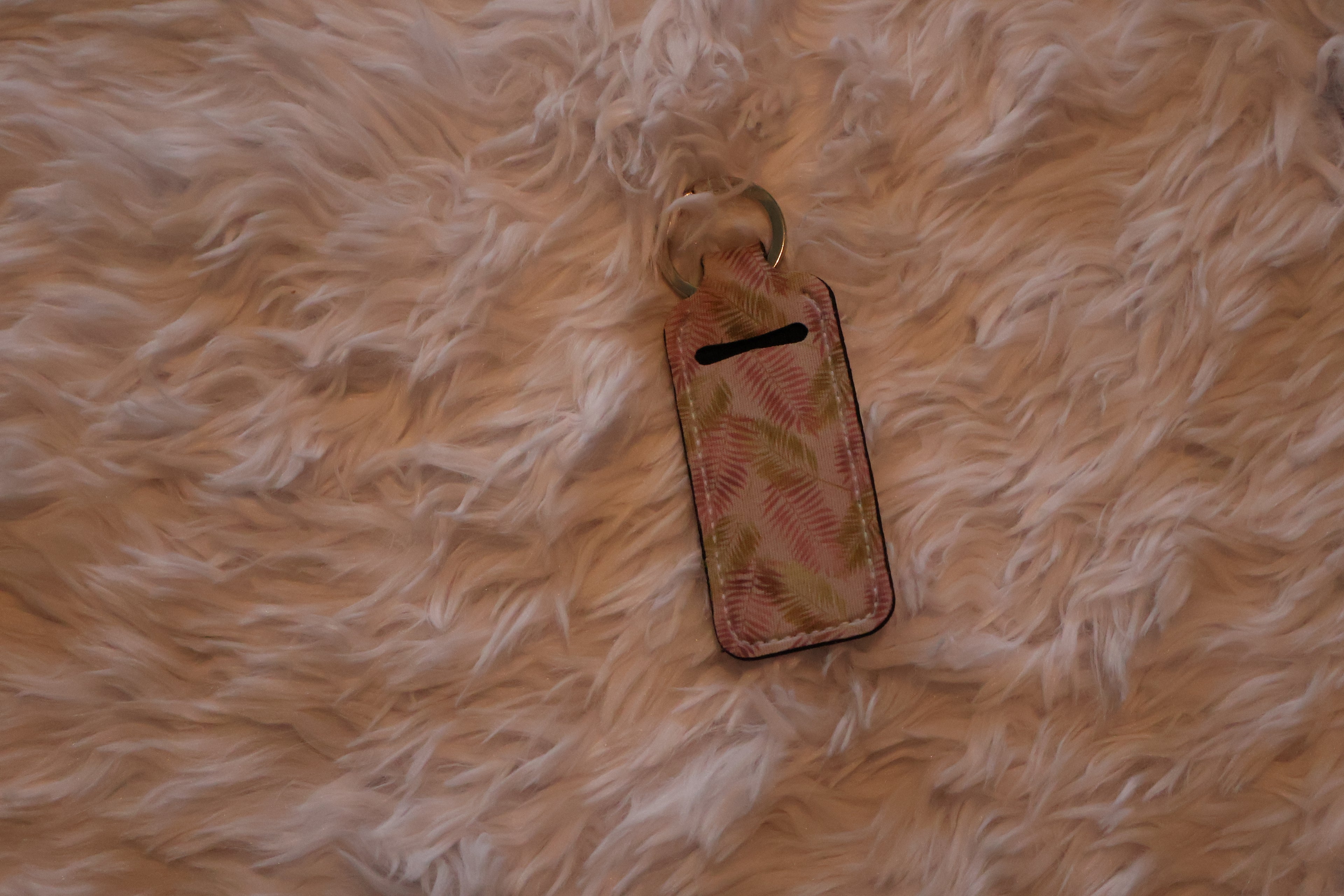 Floral-patterned chapstick holder.