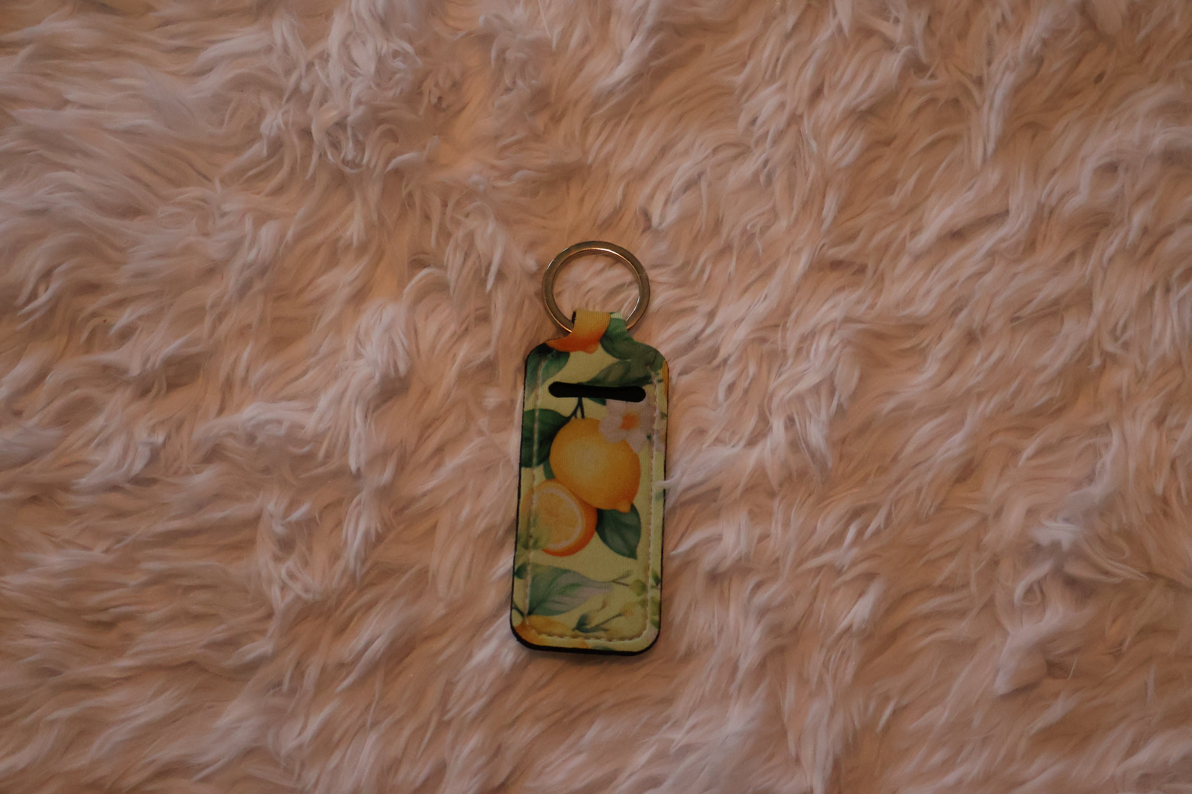 Keychain with lemon design.
